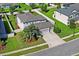 Beautiful two-story home with a two-car garage, a well-manicured lawn, and a mature palm tree in the front yard at 18558 Cortes Creek Blvd, Spring Hill, FL 34610