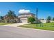 Charming two-story home with a three-car garage, landscaped yard, and a welcoming curb appeal at 18558 Cortes Creek Blvd, Spring Hill, FL 34610