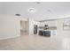 Open-concept kitchen featuring an island with stool seating, modern appliances, and sleek cabinetry at 18558 Cortes Creek Blvd, Spring Hill, FL 34610