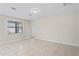 Spacious room with tile flooring, bright window and neutral paint at 18558 Cortes Creek Blvd, Spring Hill, FL 34610