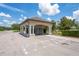 Mailboxes with sheltered area with white pillars and parking for residents at 18558 Cortes Creek Blvd, Spring Hill, FL 34610