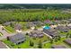 A high-angle view of a desirable neighborhood showcasing well-maintained homes and manicured lawns at 18558 Cortes Creek Blvd, Spring Hill, FL 34610