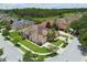 An aerial view showcases the beautiful single-story home with a lush lawn, nestled in a serene neighborhood at 20820 Amanda Oak Ct, Land O Lakes, FL 34638
