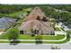 Aerial view of a charming single-story home with manicured landscaping, nestled in a tranquil community at 20820 Amanda Oak Ct, Land O Lakes, FL 34638