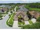 Beautiful single-Gathering home showcasing mature landscaping and a large driveway with a two-car garage at 20820 Amanda Oak Ct, Land O Lakes, FL 34638