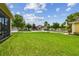 Landscaped lawn view showcasing backyard scenery, trees, and neighboring properties at 20820 Amanda Oak Ct, Land O Lakes, FL 34638