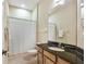 Bathroom with granite vanity, single sink, and shower-tub combo at 20820 Amanda Oak Ct, Land O Lakes, FL 34638