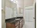 Bathroom featuring a granite vanity and lots of closet space at 20820 Amanda Oak Ct, Land O Lakes, FL 34638