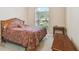 Bedroom featuring a large window, neutral paint and carpet, and classic furnishings at 20820 Amanda Oak Ct, Land O Lakes, FL 34638