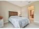 Comfortable bedroom with ensuite bathroom and doorway at 20820 Amanda Oak Ct, Land O Lakes, FL 34638