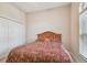 Bedroom featuring neutral paint, large window, and closet at 20820 Amanda Oak Ct, Land O Lakes, FL 34638
