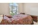 Bedroom featuring a large window, neutral paint, and classic furnishings at 20820 Amanda Oak Ct, Land O Lakes, FL 34638