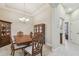 Dining room with a large table, matching wooden china cabinet, and chandelier at 20820 Amanda Oak Ct, Land O Lakes, FL 34638