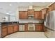 Kitchen with stainless steel appliances, granite countertops, and tiled flooring at 20820 Amanda Oak Ct, Land O Lakes, FL 34638