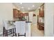 Eat-in kitchen with stainless steel appliances, granite countertops, and breakfast bar seating at 20820 Amanda Oak Ct, Land O Lakes, FL 34638