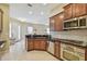 Bright kitchen with stainless steel appliances, granite countertops and an open floorplan at 20820 Amanda Oak Ct, Land O Lakes, FL 34638