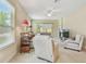 Bright living room with comfortable seating, a ceiling fan, and bright natural lighting at 20820 Amanda Oak Ct, Land O Lakes, FL 34638