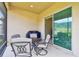 Comfortable screened patio features seating area with view of the backyard and sliding glass door entrance at 20820 Amanda Oak Ct, Land O Lakes, FL 34638