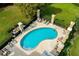 Community pool features lounge seating and a manicured landscape at 20820 Amanda Oak Ct, Land O Lakes, FL 34638