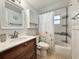 Updated bathroom with a sleek vanity, modern fixtures, and a shower-tub combination at 2141 Holiday Dr, Holiday, FL 34691