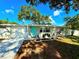 Single-story home features a freshly painted exterior and a bright, inviting front yard at 2141 Holiday Dr, Holiday, FL 34691
