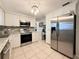 Well-equipped kitchen with stainless steel appliances, granite countertops, and ample cabinet space at 2141 Holiday Dr, Holiday, FL 34691