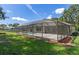 Aerial view of screened pool, showcasing the spacious backyard and tranquil setting for outdoor living at 2152 Danforth Rd, Spring Hill, FL 34608