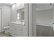 Bathroom with a bright white vanity, sleek faucet, and modern mirror at 2152 Danforth Rd, Spring Hill, FL 34608