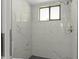 Beautiful tiled shower with black shower floor and rainfall shower head at 2152 Danforth Rd, Spring Hill, FL 34608
