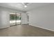 Bright bedroom with wood-look flooring and sliding glass door to the lanai at 2152 Danforth Rd, Spring Hill, FL 34608
