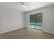Light-filled bedroom with sliding glass doors showcasing a pool view at 2152 Danforth Rd, Spring Hill, FL 34608