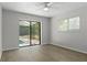 Bright bedroom with sliding glass doors offering pool views and natural light at 2152 Danforth Rd, Spring Hill, FL 34608