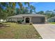 Charming single-story home features a well-manicured lawn and a two-car garage at 2152 Danforth Rd, Spring Hill, FL 34608