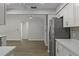 Modern kitchen boasts white cabinets, stainless steel appliances, and an open layout at 2152 Danforth Rd, Spring Hill, FL 34608