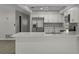 Kitchen island features quartz countertops, stainless steel appliances, and ample cabinet space at 2152 Danforth Rd, Spring Hill, FL 34608