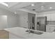 Modern kitchen has quartz counters and stainless steel appliances at 2152 Danforth Rd, Spring Hill, FL 34608