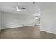 Spacious living room featuring new hardwood floors and a ceiling fan at 2152 Danforth Rd, Spring Hill, FL 34608