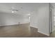 Spacious living room with neutral walls and wood flooring at 2152 Danforth Rd, Spring Hill, FL 34608