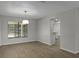 Bright living room featuring hardwood floors, a large window, and neutral color scheme at 2152 Danforth Rd, Spring Hill, FL 34608