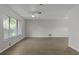 Bright living room with hardwood floors and a large window at 2152 Danforth Rd, Spring Hill, FL 34608