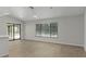 Open concept living space with wood floors and natural light at 2152 Danforth Rd, Spring Hill, FL 34608
