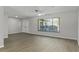 Spacious living room featuring hardwood floors, and large windows at 2152 Danforth Rd, Spring Hill, FL 34608