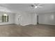 Open-concept living room and dining area with new flooring and ample natural light at 2152 Danforth Rd, Spring Hill, FL 34608