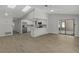 Open concept living space featuring kitchen with quartz counters, and wood floors at 2152 Danforth Rd, Spring Hill, FL 34608