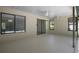 Large screened-in patio with natural light, ceiling fans, and sliding doors at 2152 Danforth Rd, Spring Hill, FL 34608