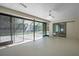 Spacious screened-in patio with ceiling fan, leading to a pool area at 2152 Danforth Rd, Spring Hill, FL 34608