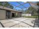 Covered outdoor patio with access to the home, providing a spacious entertainment area at 2152 Danforth Rd, Spring Hill, FL 34608