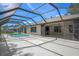 Covered pool area with access to the house, offering a refreshing outdoor retreat at 2152 Danforth Rd, Spring Hill, FL 34608