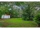 Large backyard with storage shed and mature foliage at 2169 Danforth Rd, Spring Hill, FL 34608