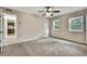A bedroom featuring two windows and neutral walls at 2169 Danforth Rd, Spring Hill, FL 34608